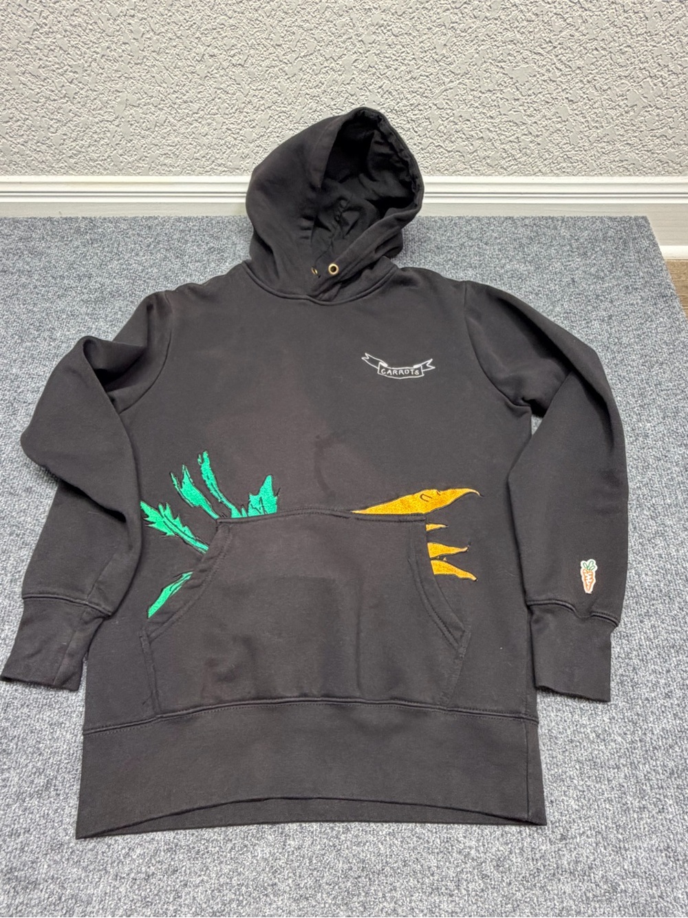 Black Graphic Pullover Hoodie with Green & Gold Accents